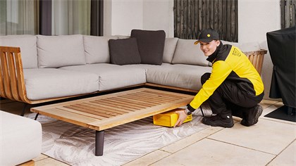 Delivery person leaves parcel on terrace